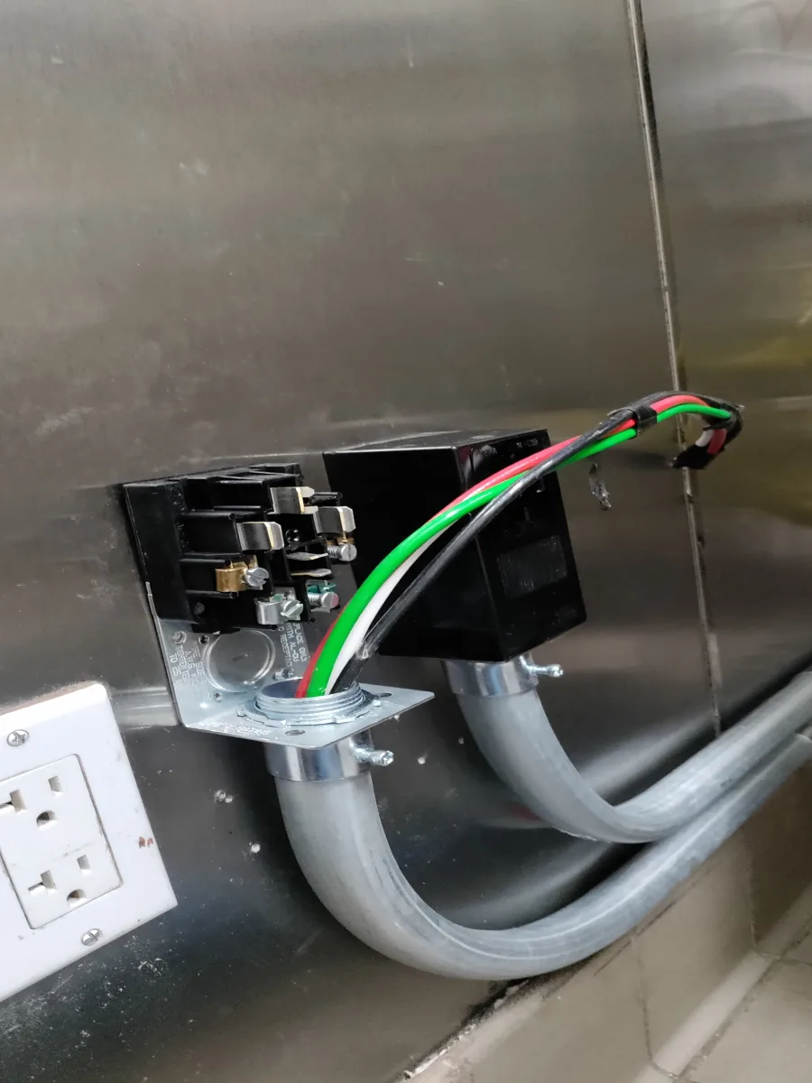 Electric range receptacle wiring and conduit during a New York City kitchen appliance circuit installation