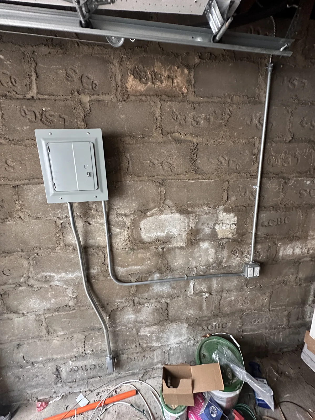 Garage subpanel and dedicated circuit installation in NYC New electrical subpanel and dedicated garage receptacle circuit installed on a masonry wall at a New York City property