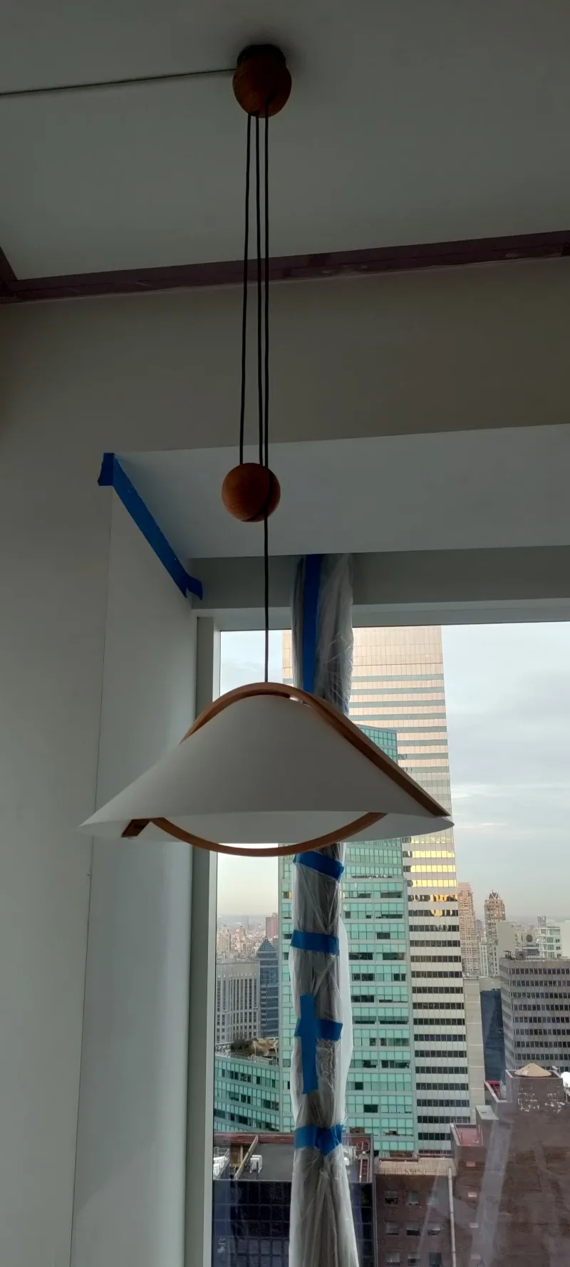 Modern pendant-light installation Modern pendant light installed in a New York City apartment interior
