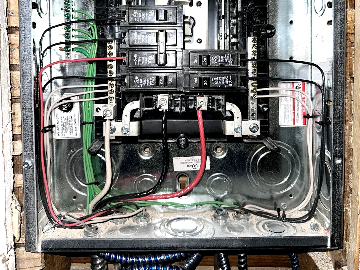 Example image of panel upgrade equipment and breaker-panel wiring conditions in New York City.