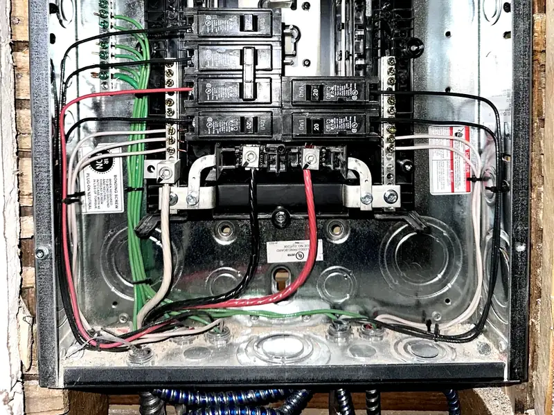 Open breaker panel during electrical panel upgrade and circuit review